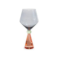 Calice per gin tonic in vetro con base effetto diamante. Colore pesca e grigio.